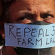 A woman participates in a protest against new farm laws in Mumbai, India, Saturday, Feb. 6, 2021.